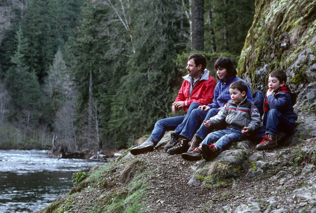Family with children on a mountain trail